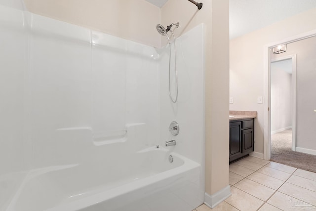 bathroom with tile patterned flooring, vanity, and shower / washtub combination