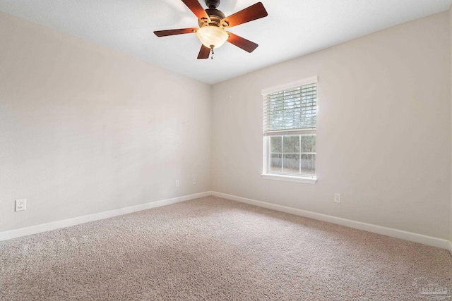 carpeted empty room featuring ceiling fan