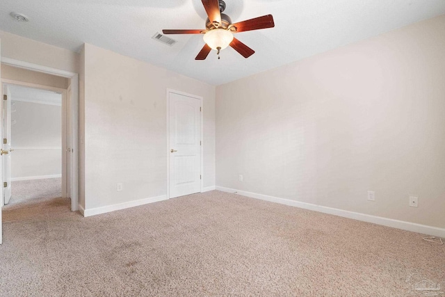 unfurnished bedroom with ceiling fan and carpet