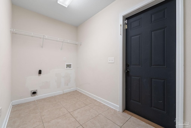 laundry room with hookup for an electric dryer, hookup for a washing machine, and light tile patterned floors