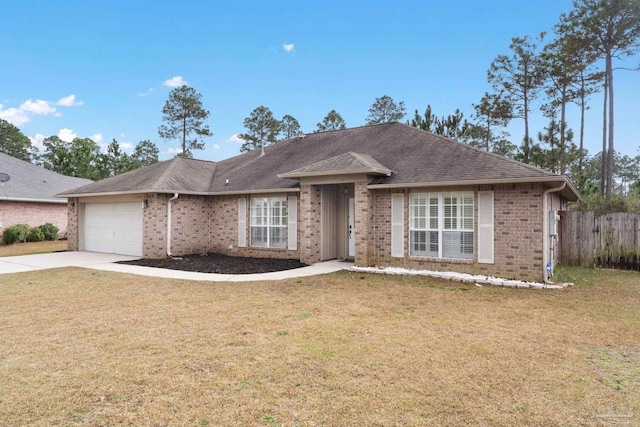 ranch-style home with a garage and a front yard