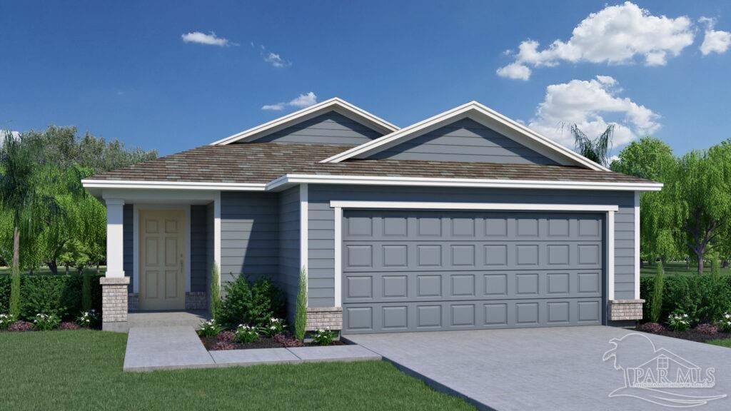 view of front of house with a garage and a front lawn