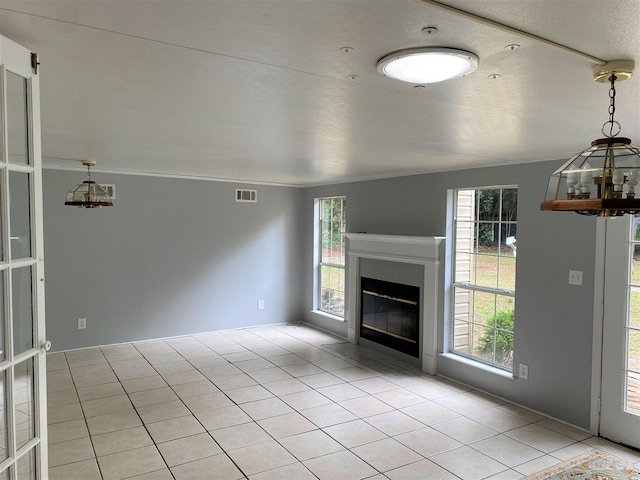 unfurnished living room featuring light tile patterned floors