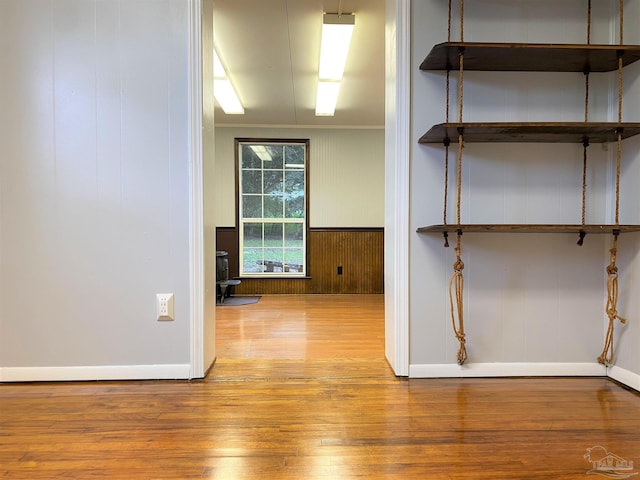 unfurnished room featuring crown molding and hardwood / wood-style flooring