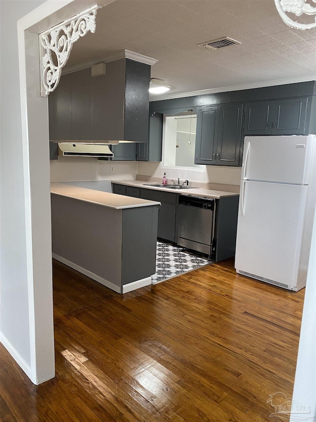 kitchen with white fridge, sink, stainless steel dishwasher, and dark hardwood / wood-style floors