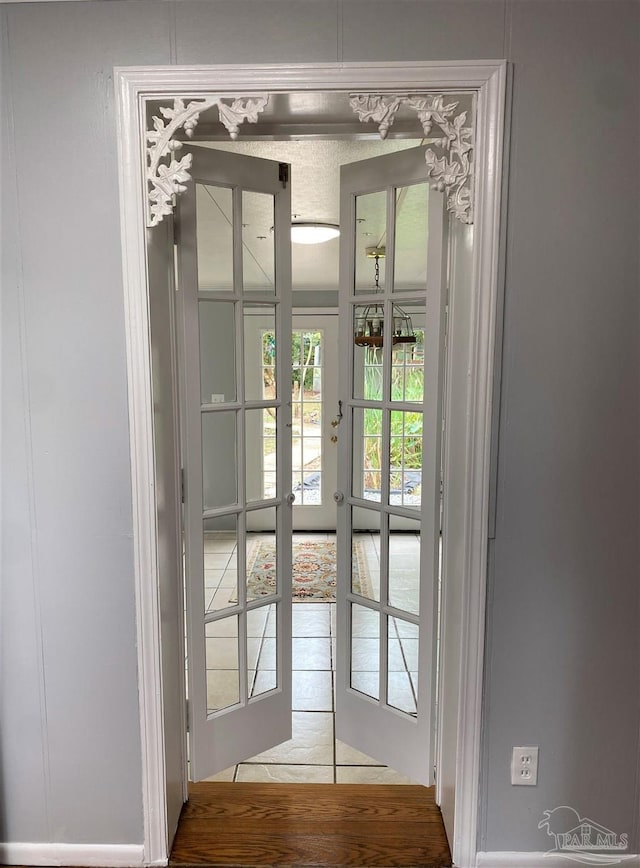 entryway featuring french doors