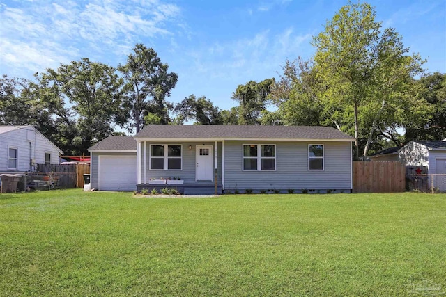 view of front of property featuring a garage and a front yard