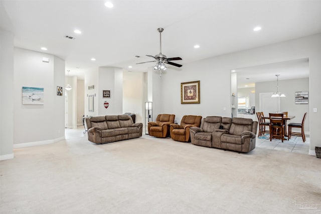 living room featuring ceiling fan and light carpet