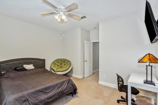 bedroom with light carpet and ceiling fan