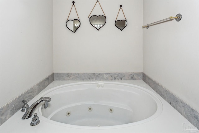 bathroom featuring a washtub