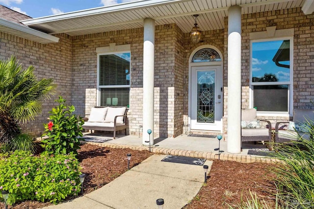 entrance to property featuring covered porch