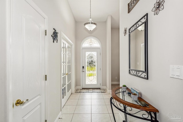 foyer featuring light tile patterned floors