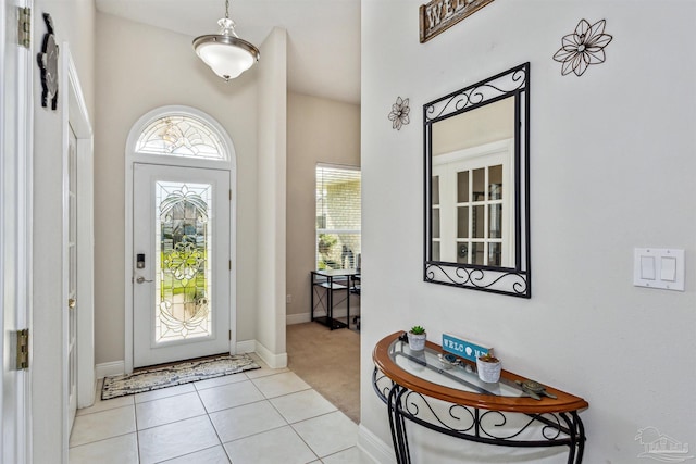 foyer entrance featuring light tile patterned floors