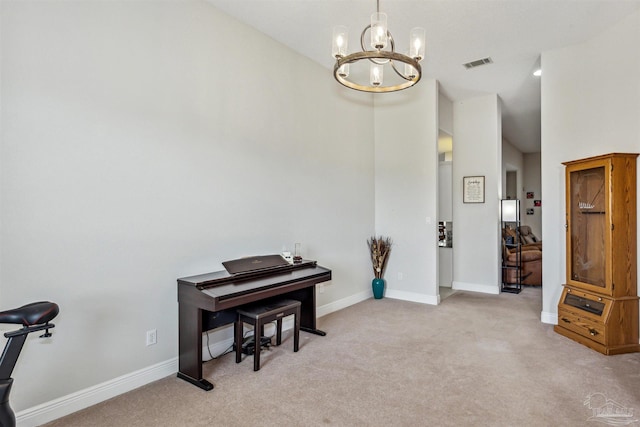 miscellaneous room with light colored carpet and an inviting chandelier