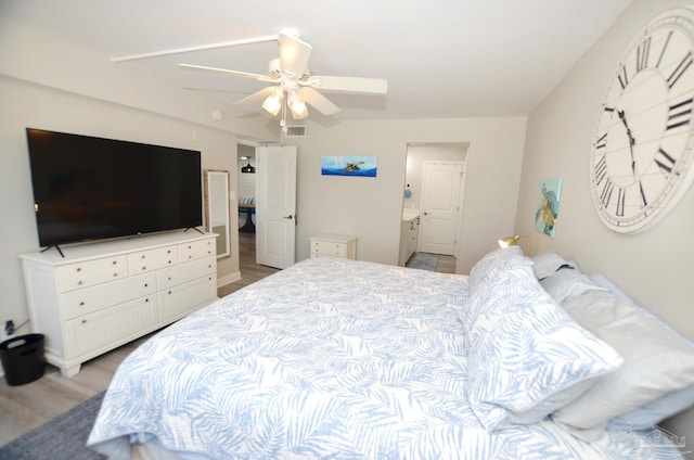 bedroom featuring hardwood / wood-style flooring and ceiling fan