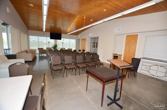 dining area with high vaulted ceiling, wooden ceiling, and concrete flooring