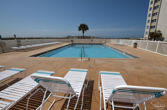 view of swimming pool with a patio