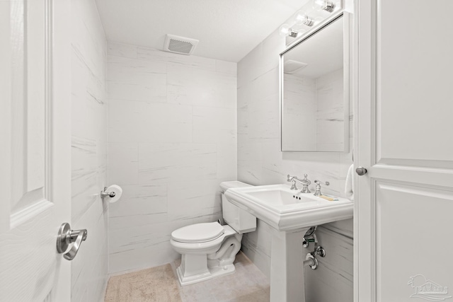 bathroom featuring toilet