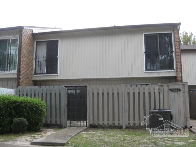 view of home's exterior featuring fence