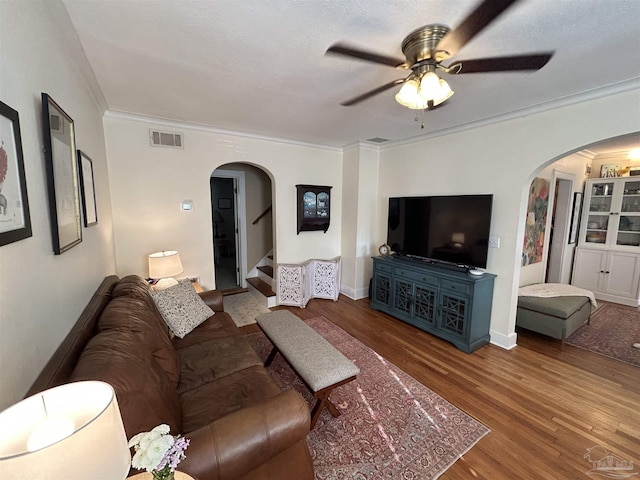 1726 N 15th Ave, Pensacola, FL 32503 - living area with arched walkways, ceiling fan, ornamental molding, wood finished floors, and stairway