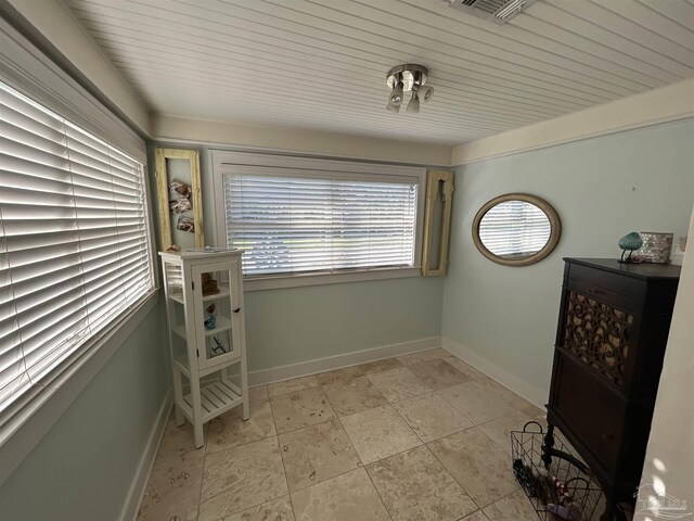 1726 N 15th Ave, Pensacola, FL 32503 - interior space with baseboards and light stone finish floors