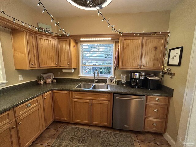 1726 N 15th Ave, Pensacola, FL 32503 - kitchen with stainless steel dishwasher, a sink, dark tile patterned floors, and dark countertops