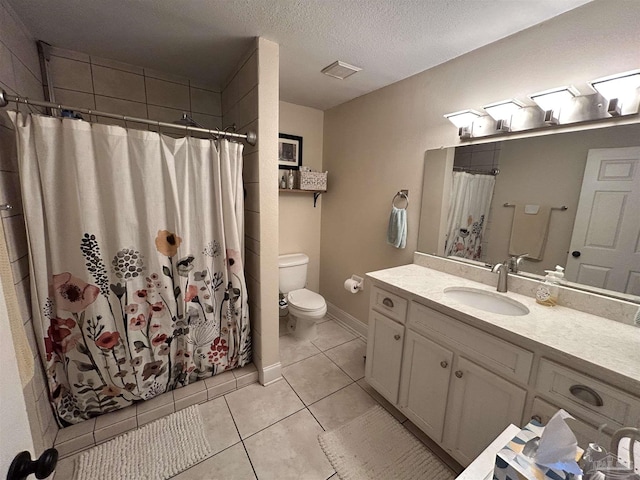 1726 N 15th Ave, Pensacola, FL 32503 - bathroom with toilet, vanity, tile patterned flooring, curtained shower, and a textured ceiling