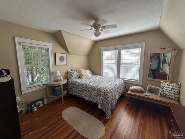 1726 N 15th Ave, Pensacola, FL 32503 - bedroom featuring lofted ceiling, wood finished floors, multiple windows, ceiling fan, and a textured ceiling