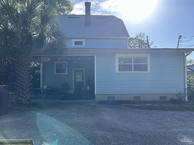 1726 N 15th Ave, Pensacola, FL 32503 - rear view of house with crawl space and a chimney