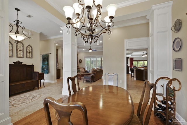 2926 Greystone Dr, Pace, FL 32571 - dining area with crown molding, plenty of natural light, baseboards, a chandelier, and light tile patterned flooring