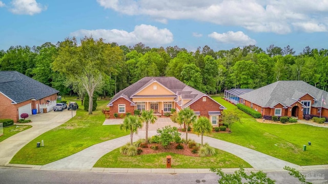 2926 Greystone Dr, Pace, FL 32571 - view of front of home featuring curved driveway and a front yard