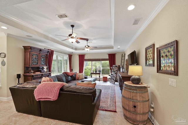 2926 Greystone Dr, Pace, FL 32571 - living room featuring crown molding, a raised ceiling, a ceiling fan, light tile patterned flooring, and baseboards