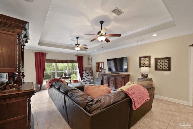 2926 Greystone Dr, Pace, FL 32571 - living room with a tray ceiling, crown molding, ceiling fan, light tile patterned flooring, and baseboards