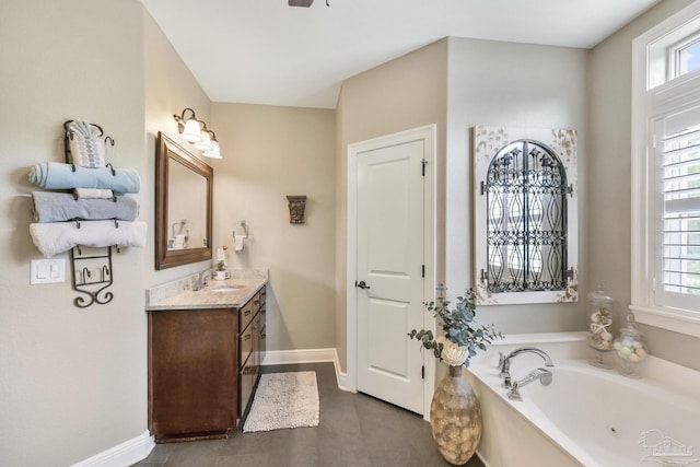 2926 Greystone Dr, Pace, FL 32571 - full bath with baseboards, plenty of natural light, vanity, and a bath
