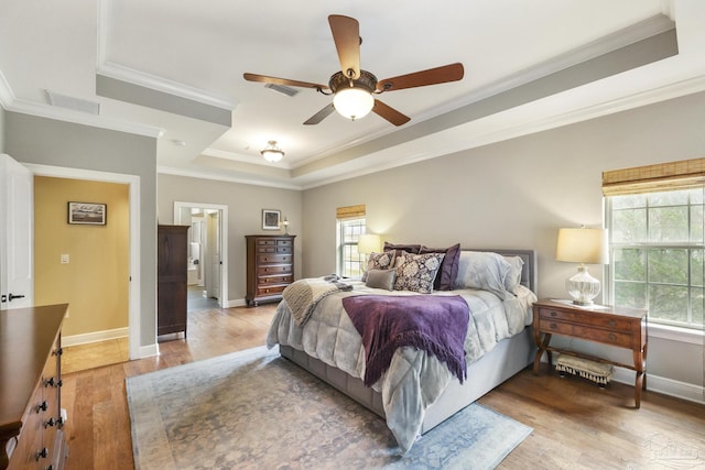 2926 Greystone Dr, Pace, FL 32571 - bedroom with a raised ceiling, ornamental molding, light wood-style flooring, baseboards, and a ceiling fan