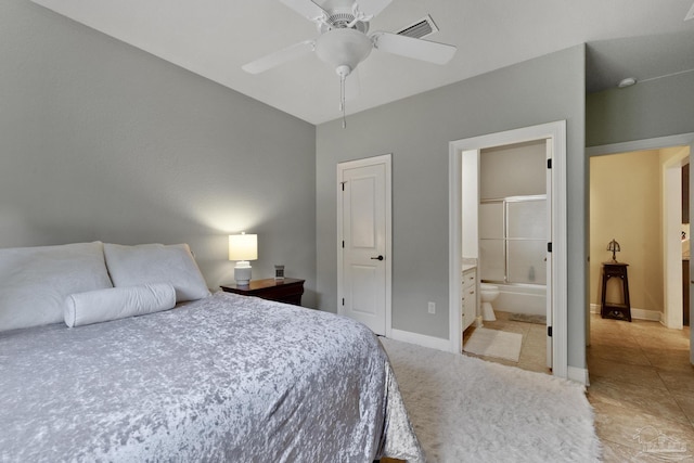 2926 Greystone Dr, Pace, FL 32571 - bedroom featuring baseboards, ensuite bath, a ceiling fan, and light colored carpet