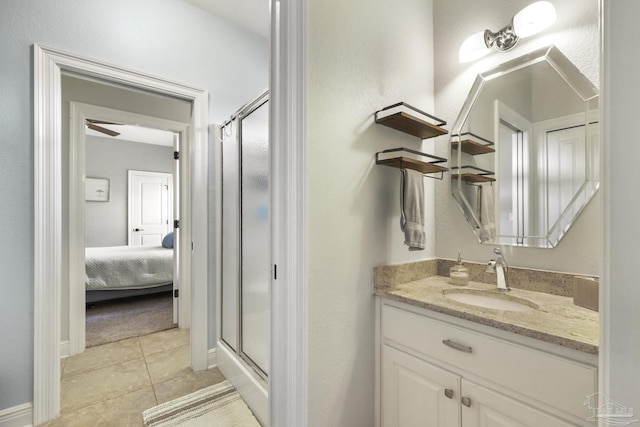 2926 Greystone Dr, Pace, FL 32571 - ensuite bathroom featuring a shower stall, tile patterned floors, vanity, and baseboards