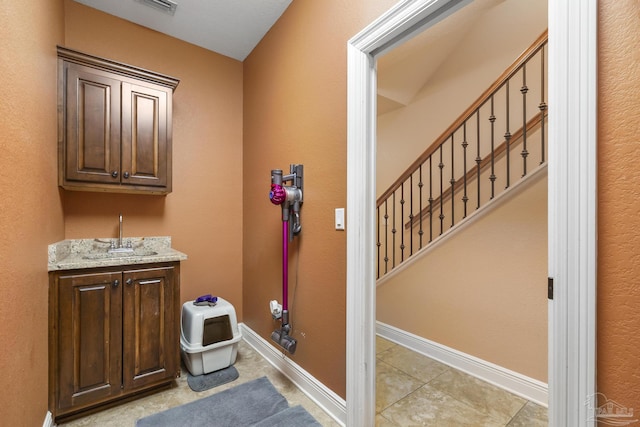 2926 Greystone Dr, Pace, FL 32571 - bathroom featuring tile patterned floors, baseboards, and vanity