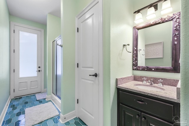 2926 Greystone Dr, Pace, FL 32571 - full bath featuring a shower stall, vanity, and baseboards