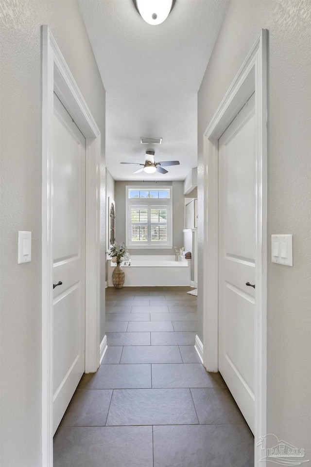 2926 Greystone Dr, Pace, FL 32571 - hallway with tile patterned flooring