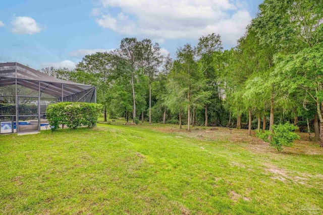 2926 Greystone Dr, Pace, FL 32571 - view of grassy yard featuring an outdoor pool and glass enclosure