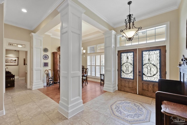 2926 Greystone Dr, Pace, FL 32571 - foyer featuring decorative columns, crown molding, a chandelier, french doors, and light tile patterned floors