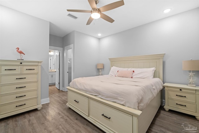 bedroom featuring ceiling fan, hardwood / wood-style floors, and ensuite bathroom