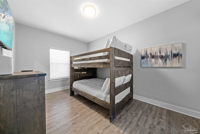 bedroom with hardwood / wood-style flooring