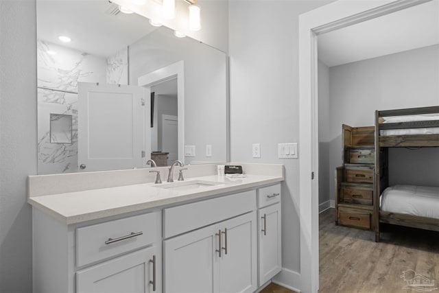 bathroom featuring wood-type flooring and vanity