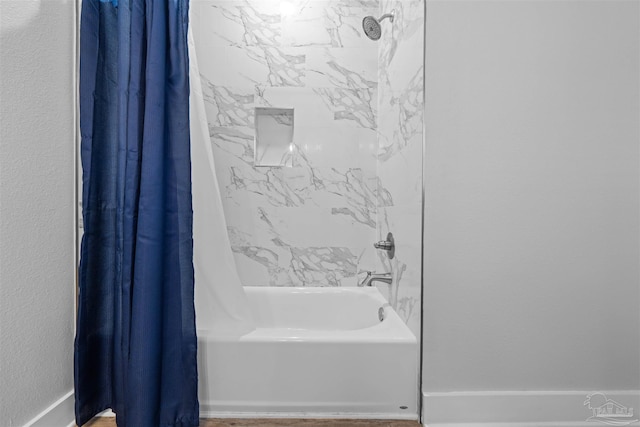 bathroom featuring shower / bath combo with shower curtain