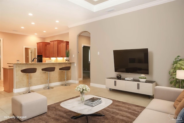 4436 Soundside Dr, Gulf Breeze, FL 32563 - living room featuring light tile patterned floors, arched walkways, crown molding, recessed lighting, and baseboards