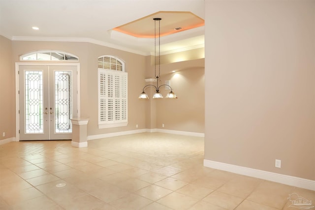 4436 Soundside Dr, Gulf Breeze, FL 32563 - entryway with french doors, light tile patterned floors, baseboards, crown molding, and plenty of natural light