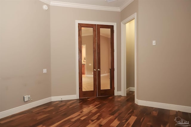 4436 Soundside Dr, Gulf Breeze, FL 32563 - empty room with french doors, ornamental molding, baseboards, and dark wood-style flooring