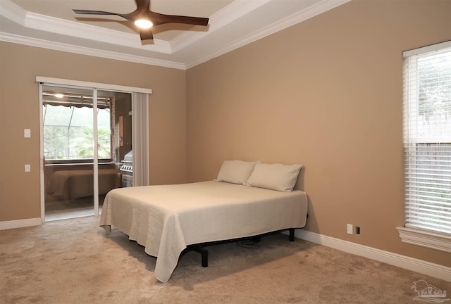 4436 Soundside Dr, Gulf Breeze, FL 32563 - bedroom featuring crown molding, a raised ceiling, multiple windows, light colored carpet, and access to outside